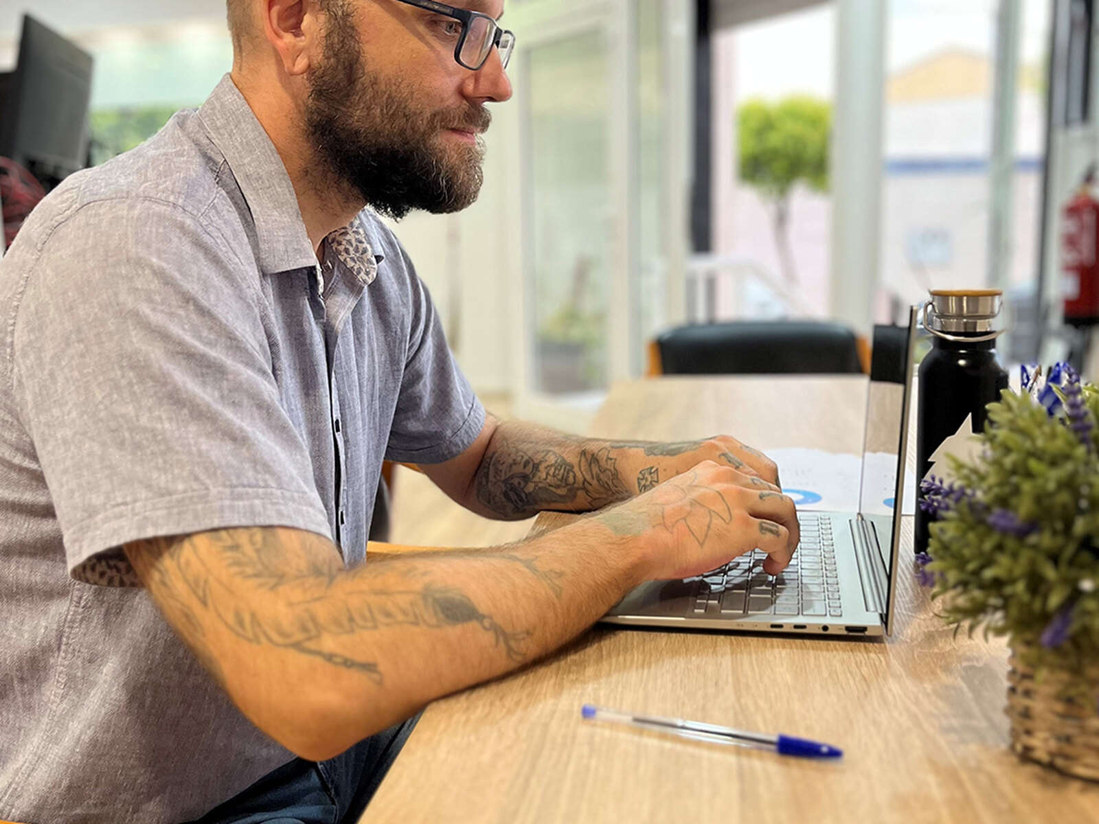 Björn Nyström, founder of Demon Dog, working on a laptop in the Sax office.