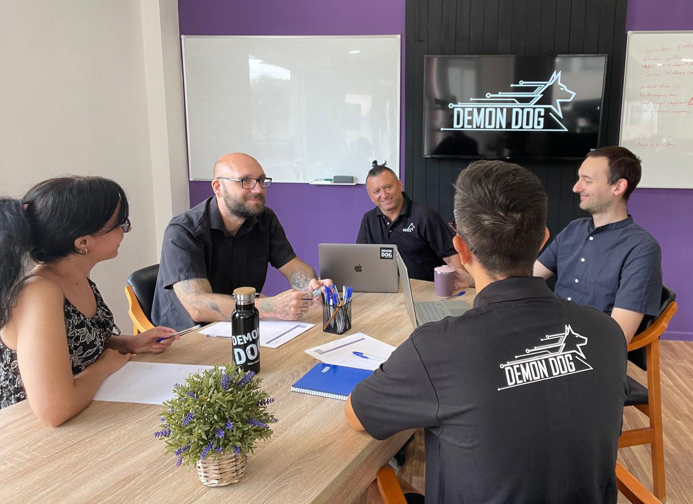 Demon Dog team together in the office.